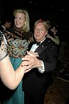 Arnold Scaasi and guest  at the Casita Maria  70th. Anniversary Fiesta  at the Plaza Hotel  on October 19, 2004 in Manhattan, N.Y. photo by Rob Rich copyright 2004 516-676-3939  robwayne1@aol.com