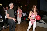 Lauren Vernon getting some bowling tips from Richard Gere at the Children's Advocacy Center of Manhattan's 8th. Annual Bowling Bowl at the Chelsea Pier on May 12, 2004. (photo by Rob Rich copyright 2004<br>516-676-3939)