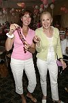 Displaying their fine jewels  at the Evelyn Lauder Breast Cancer Golf Tournament at Hampton Hills Golf Course in Westhamtpon on 8-5-04.<br>photo by Rob Rich copyright 2004 516-676-3939  robwayne1@aol.com