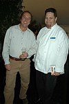 Scott Rella (Fear no Ice) and Michael Meehan and Culinary Director from Peconic Bay  at the Peconic Bay Winery 3rd. Annual Thanksgiving Barrell Tasting on 11-21-04 in Cutchogue, N.Y., honoring Larry Forgione and benefitting the NYIT Culinary Arts Program.<br>photo by Rob Rich copyright 2004 516-676-3939 robwayne1@aol.com